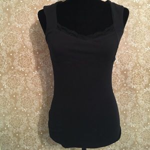 Lacy, form fitting top with cutout back.